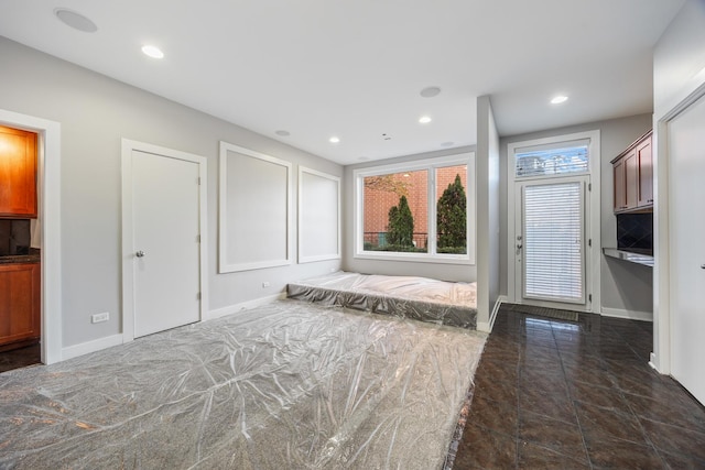 interior space with dark tile patterned flooring