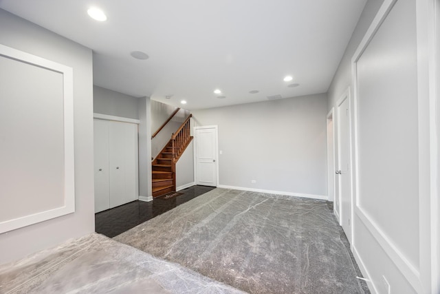 interior space with dark carpet