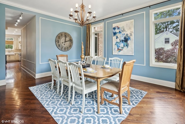 dining room featuring plenty of natural light, an inviting chandelier, dark wood-type flooring, and ornamental molding