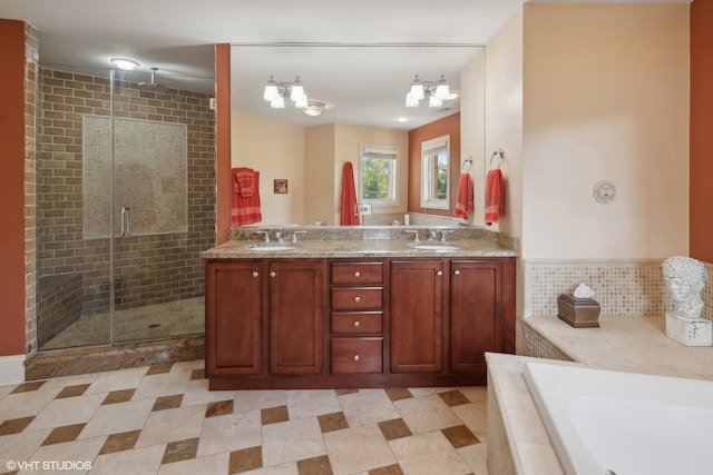 bathroom with vanity, a chandelier, and shower with separate bathtub