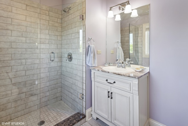 bathroom with vanity and a shower with shower door