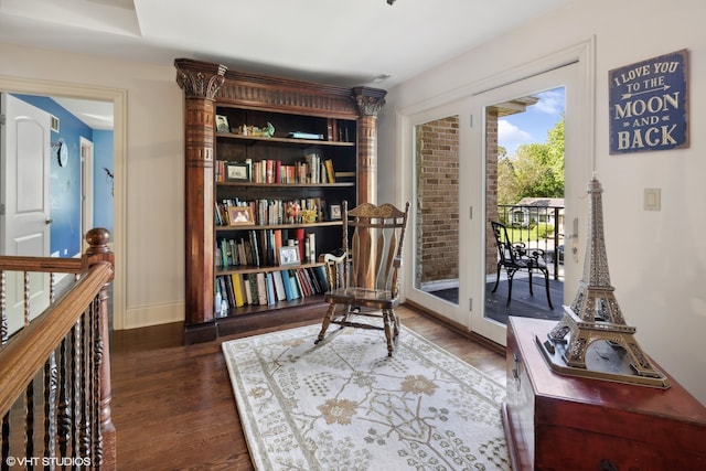 sitting room featuring dark hardwood / wood-style floors