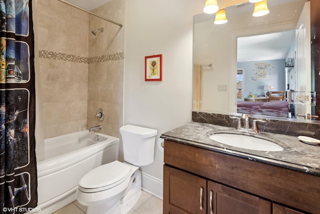 full bathroom featuring tile patterned floors, vanity, toilet, and shower / tub combo