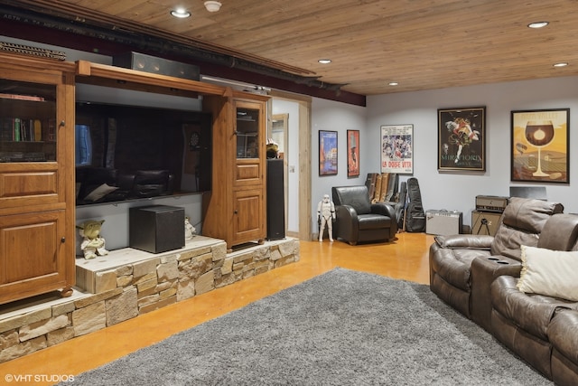 cinema room with wood ceiling and concrete flooring