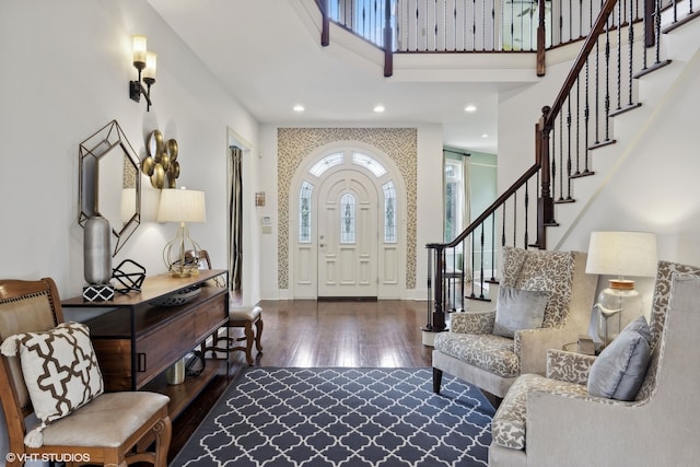 foyer entrance with dark hardwood / wood-style floors