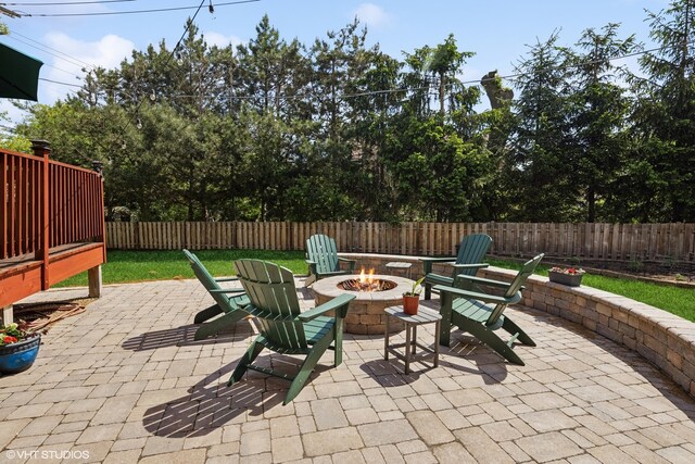 view of patio with a fire pit