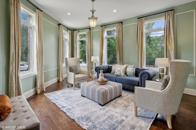 living area with hardwood / wood-style floors