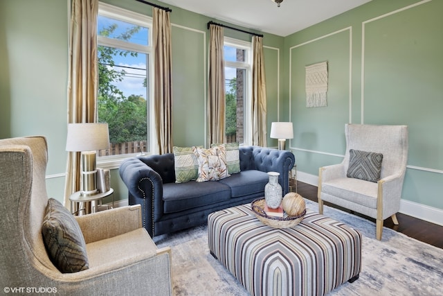 living area with hardwood / wood-style flooring