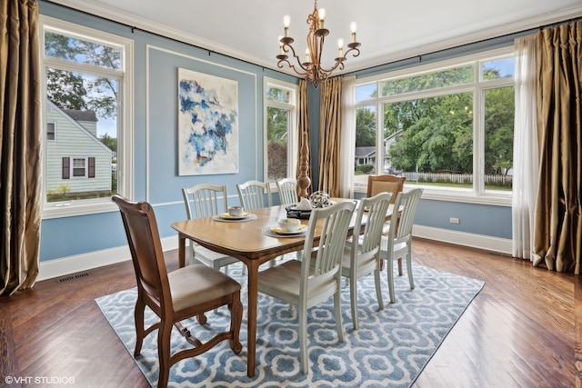 dining area with a notable chandelier, a healthy amount of sunlight, and dark hardwood / wood-style flooring