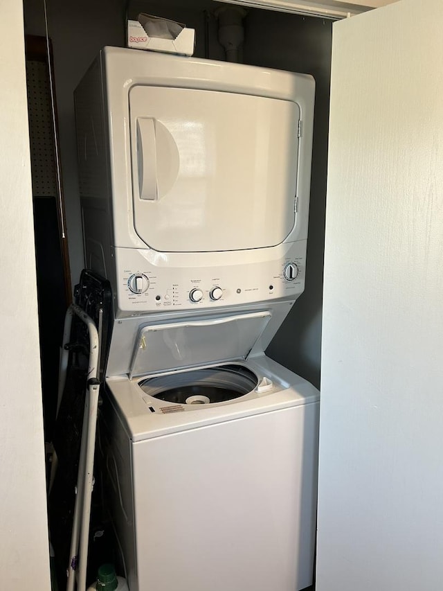 laundry room featuring stacked washing maching and dryer