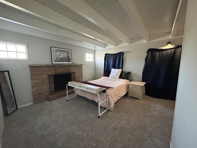 bedroom featuring multiple windows, a fireplace, and carpet floors