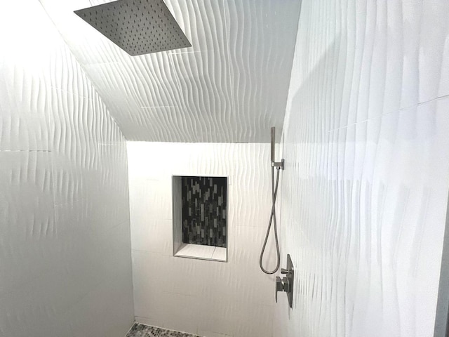 interior details featuring a shower