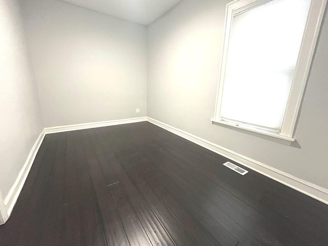 spare room featuring hardwood / wood-style floors