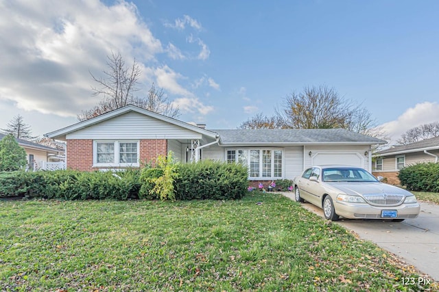 ranch-style house with brick siding, an attached garage, and driveway