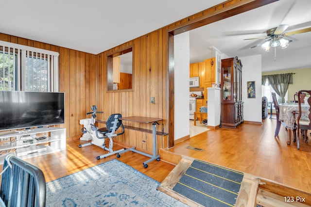 kitchen featuring white appliances, independent washer and dryer, and light tile patterned floors