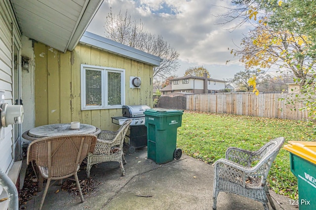 view of yard with an outbuilding, a shed, and a fenced backyard