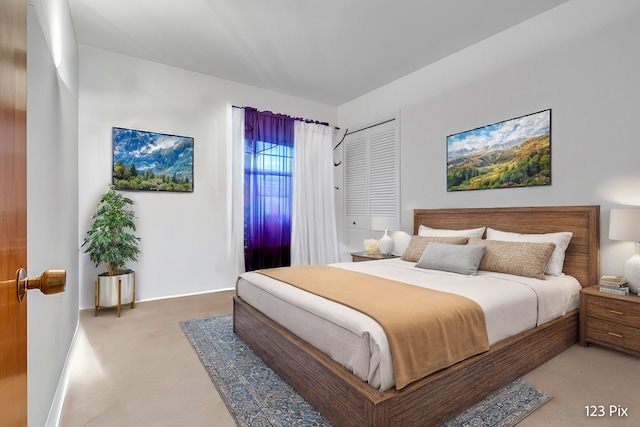 bedroom with carpet and a closet