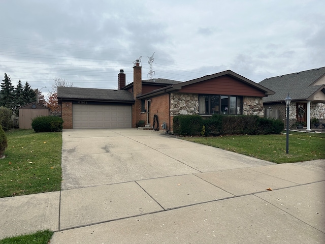 single story home featuring a garage and a front lawn