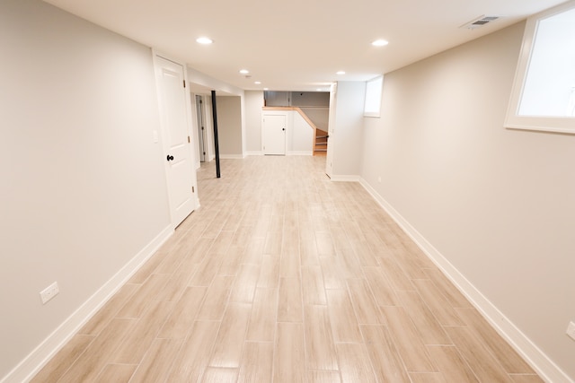 basement featuring light wood-type flooring