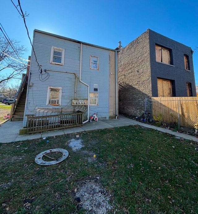 rear view of house with a lawn