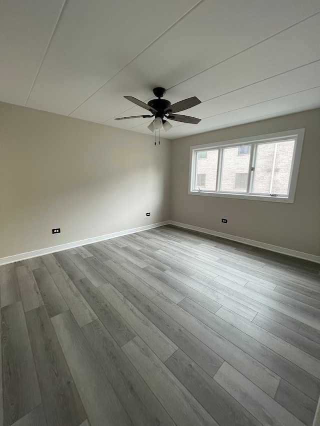 unfurnished room with ceiling fan and light hardwood / wood-style flooring