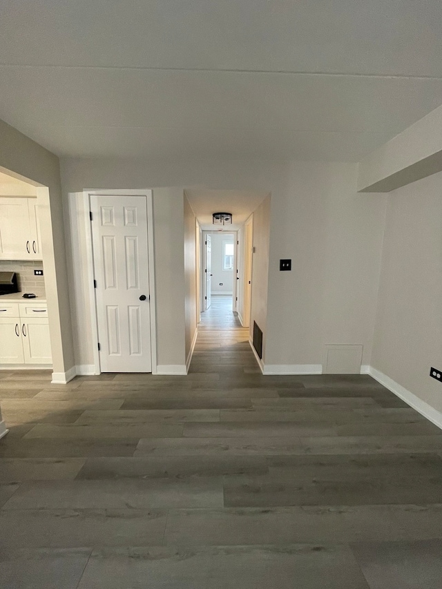 hallway featuring wood-type flooring