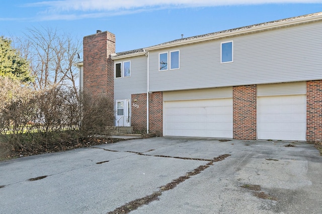 view of side of home with a garage