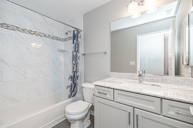 full bathroom with shower / bath combo, toilet, and vanity