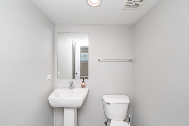 bathroom featuring sink and toilet