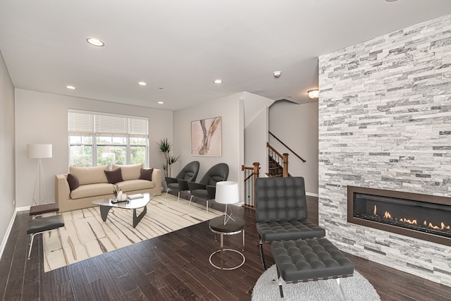 living room with a fireplace and hardwood / wood-style floors