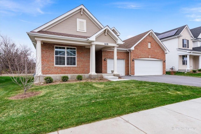 view of front of house featuring a garage and a front yard