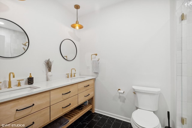 full bathroom with a sink, baseboards, toilet, and double vanity