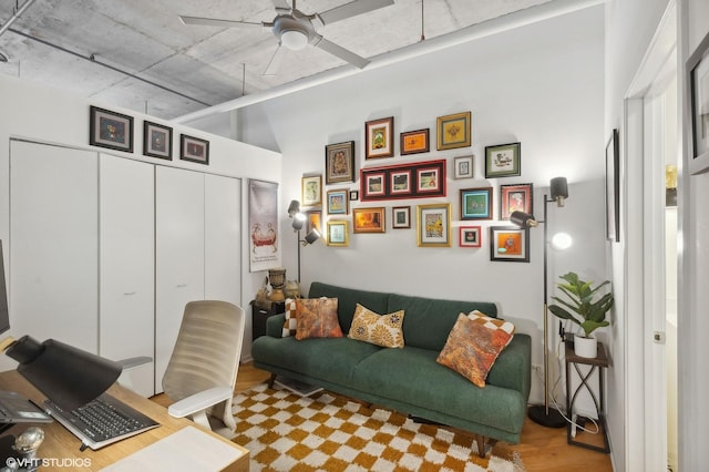 home office with a ceiling fan and wood finished floors