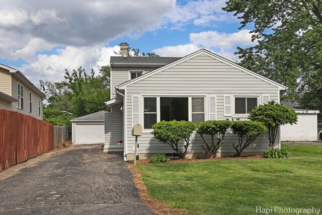 517 Grandview Dr, Round Lake Park, IL 60073 - view of front of home featuring a chimney, an outdoor structure, and a garage