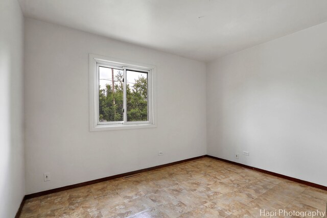 517 Grandview Dr, Round Lake Park, IL 60073 - empty room with baseboards