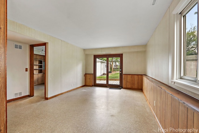 517 Grandview Dr, Round Lake Park, IL 60073 - spare room with light floors, baseboards, and wooden walls