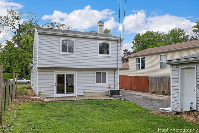 517 Grandview Dr, Round Lake Park, IL 60073 - rear view of house with a chimney and central air condition unit