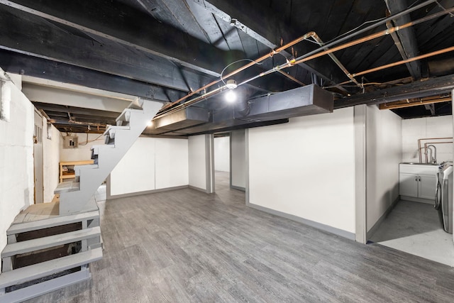 1326 Arthur Ave, Joliet, IL 60432 - below grade area featuring stairs, wood finished floors, a sink, and baseboards