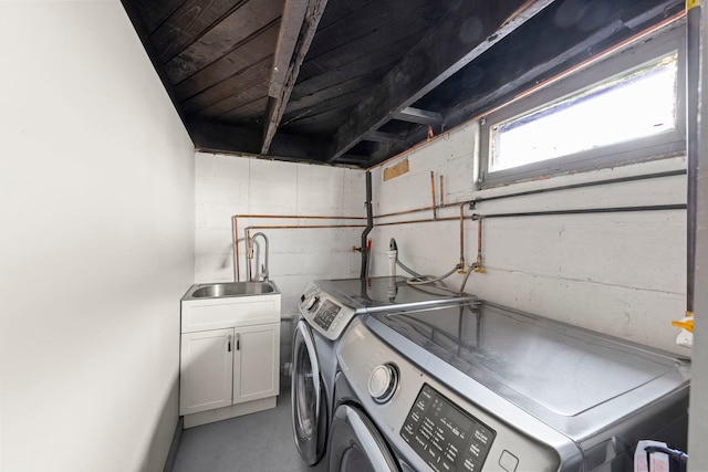 1326 Arthur Ave, Joliet, IL 60432 - laundry room featuring independent washer and dryer, cabinet space, and concrete block wall