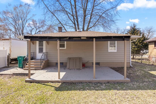 1326 Arthur Ave, Joliet, IL 60432 - back of property featuring a patio, a shingled roof, and a chimney
