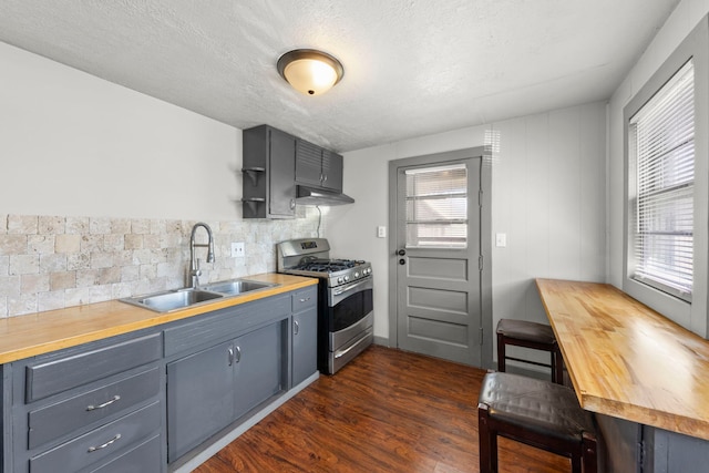 1326 Arthur Ave, Joliet, IL 60432 - kitchen with gas stove, a sink, under cabinet range hood, butcher block countertops, and dark wood-style floors