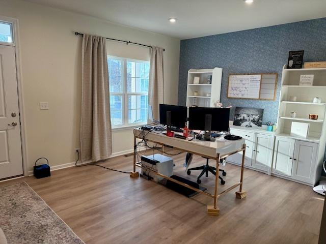 office area with light hardwood / wood-style floors