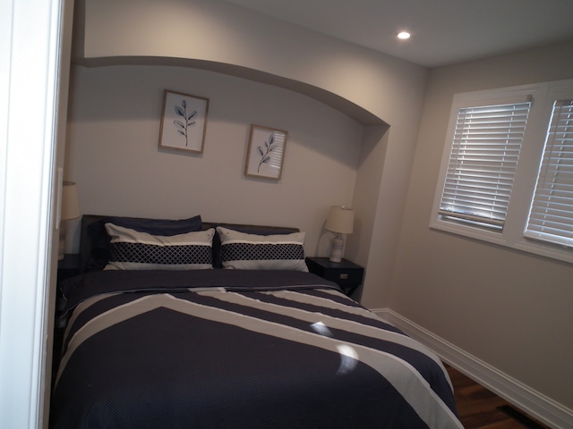 bedroom with hardwood / wood-style floors