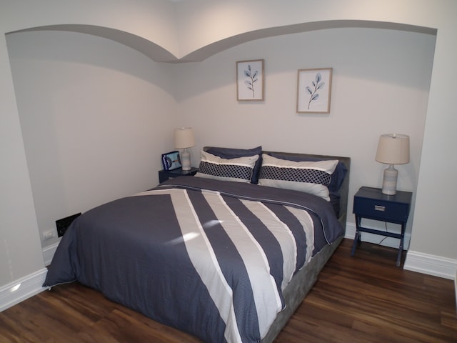 bedroom featuring dark hardwood / wood-style floors