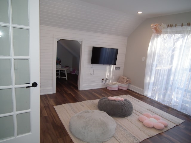 bedroom with dark wood-type flooring and vaulted ceiling