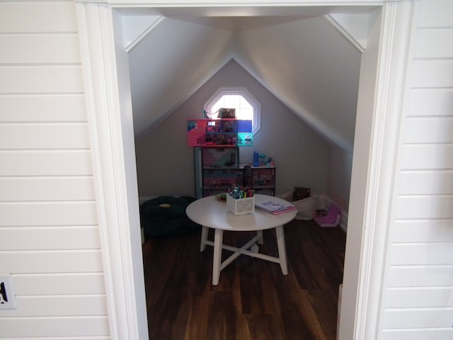 game room with hardwood / wood-style flooring and vaulted ceiling