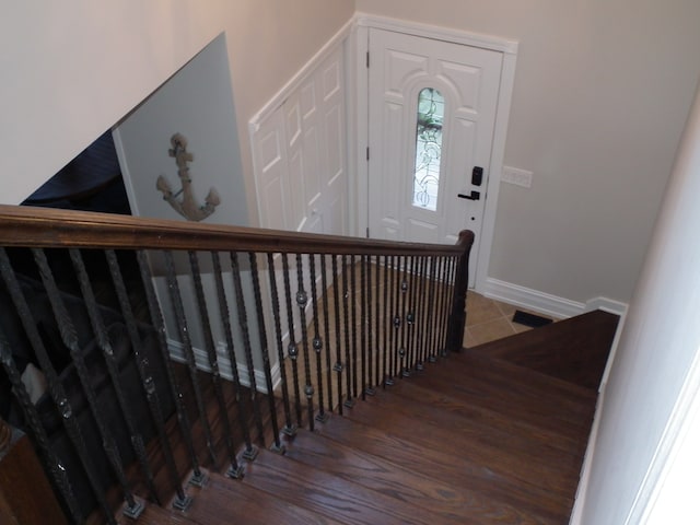 staircase with wood-type flooring