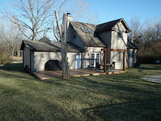 rear view of property with a lawn and a patio