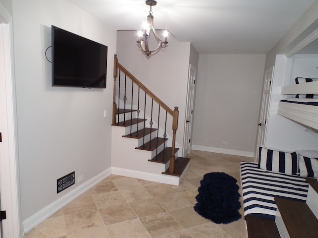 entrance foyer with a chandelier