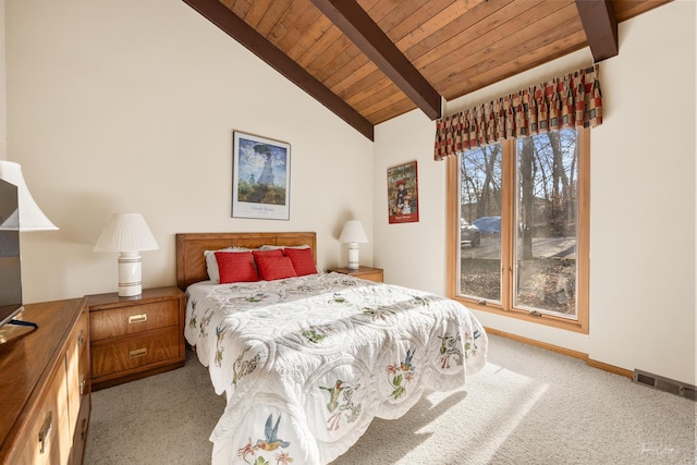 bedroom with vaulted ceiling with beams, light colored carpet, and wood ceiling